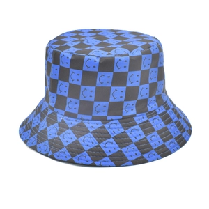 Detailed blue and black checkerboard bucket hat with smiling face icons on high-quality fabric