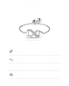Macro detail of 925 sterling silver infinity chain ring with micro-pave white zircon stones