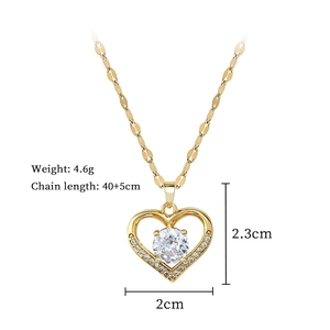 Detail view of gold heart necklace pendant with dimensions 2cm x 2.3cm and chain length