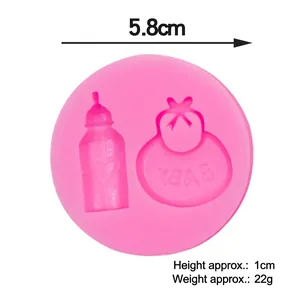 Pink silicone baby mold featuring bottle and bib shapes for fondant cake decorating