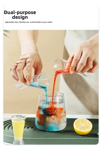 Dual-head glass jigger pouring red and blue liquids for cocktail preparation