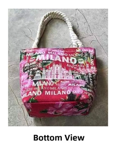 Detailed bottom view of pink floral canvas beach bag with printed Milano architecture motif