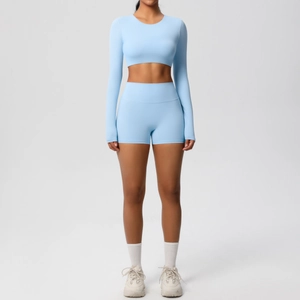 Close-up of the sky blue long sleeve crop top and high waist gym shorts set details