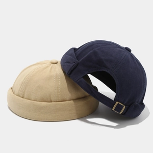 Adjustable cotton docker hats in khaki and navy blue with vintage metal buckles