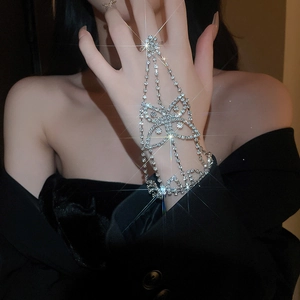 Close-up of sparkling rhinestone butterfly hand harness chain with integrated ring