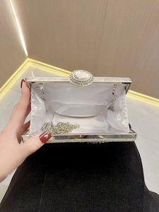 Silver rhinestone evening clutch with crystal oval buckle and metal chain strap