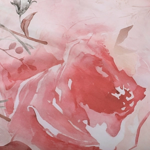 Detailed view of floral lace fabric with red and pink watercolor flowers on long sleeve dress