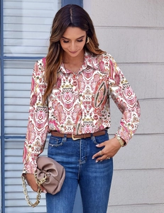 Detailed close-up of multi-color vintage paisley print and fabric texture on a long-sleeve shirt
