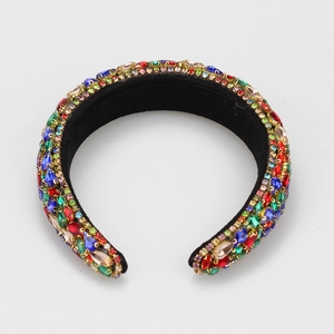 Detail of colorful multi-faceted crystals on luxurious Baroque padded velvet headband