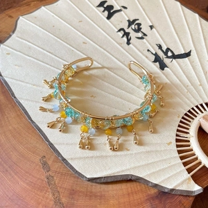 Neo-Chinese style golden open bangle with blue yellow beads and drop pendants