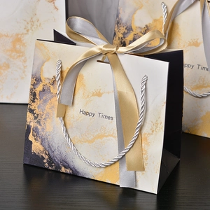 Elegant marble pattern gift bag with ribbon handles and Happy Times gold decorative print