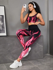 Detail view of seamless high-waist yoga leggings with red flame pattern for fitness