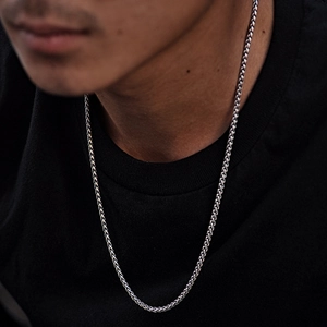 Titanium steel silver Cuban chain necklace worn by male model for casual minimalist styling