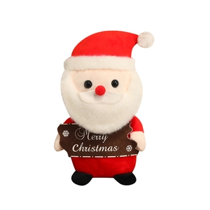 Simpatico Babbo Natale di peluche con cartello Merry Christmas e cappello rosso