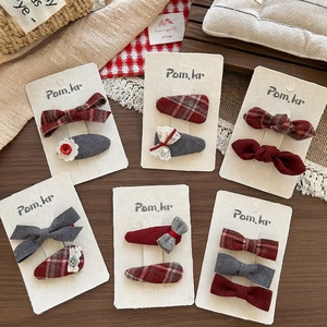 Red bow hair clips set with plaid patterns and lace details for girls on white card