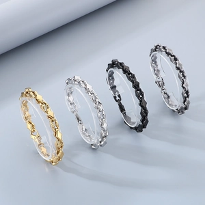 Detailed display of melon seed link bracelets in gold, silver, black, and dark gray steel