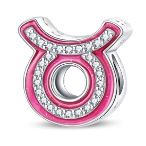 Macro view of silver-plated Taurus zodiac charm with pink enamel and white zircon stones