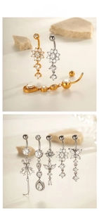 Détail de piercings de nombril avec pendentifs papillon et fleur sertis de zircons