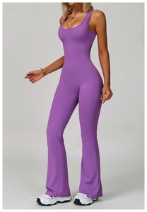 Detail of purple high-stretch yoga jumpsuit featuring a racerback top and flared trousers