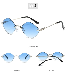 Detail view of rimless diamond cut sunglasses with blue gradient lenses and silver arms