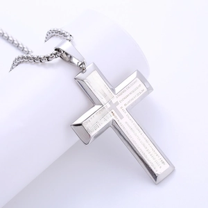 Polished stainless steel cross pendant necklace with laser-etched Spanish Lord's Prayer