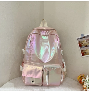 Detailed close-up of pink holographic laser PU backpack with branded logo patch