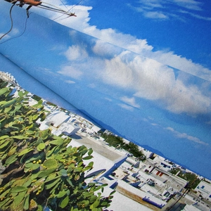 Detailed macro view of the Mediterranean Santorini landscape print on fabric texture