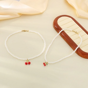 Sweet red resin cherry pendant necklace with white pearls and gold lobster clasp