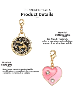 Detail of tarot zodiac pendants with black enamel Sagittarius and pink yin yang heart charms