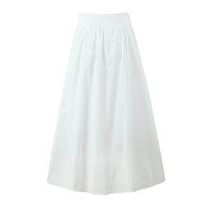 Detail of white A-line long skirt featuring delicate waist pleats and elegant drape