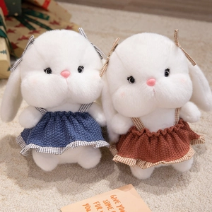 Plush long-eared bunnies in knitted dresses with bows for children's gifts