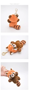 Three-way view of red panda plush keychain with striped tail and golden clasp