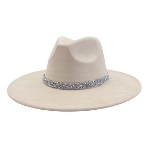 Detail of the sparkling rhinestone band on a wide brim felt fedora hat in beige