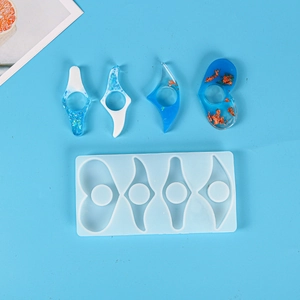 Detailed view of silicone resin molds with blue artistic ring bookmark finished products