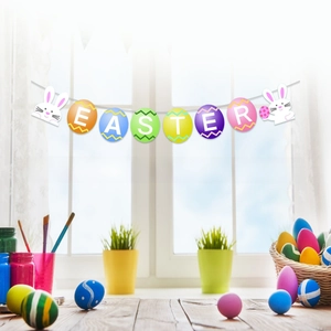 Close-up of Happy Easter banner with colorful eggs and rabbits hanging by a window