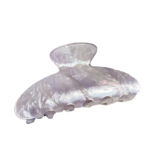 Elegant large marbled purple acrylic hair claw clip for women on a white background