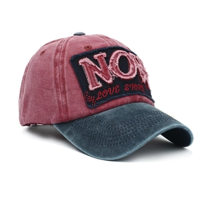 Vintage washed red and navy baseball cap with embroidered NOW patch and distressed brim
