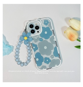 Detail view of blue frangipani flower iPhone case with matching beaded wrist strap