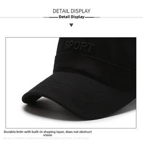 Detailed macro view of black sport cap with sturdy brim and white embroidered sport text