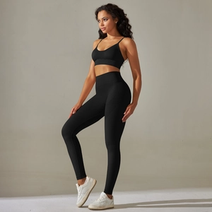 Detail view of black seamless yoga set showing high-waist leggings and ribbed sports bra