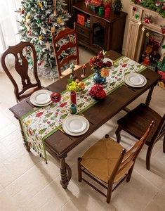 Detail of a Christmas table runner with jacquard holiday patterns and festive tassels