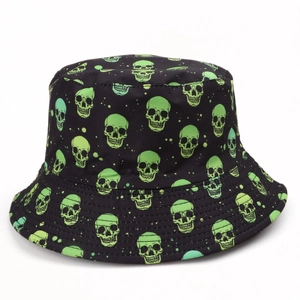 Reversible skull print bucket hat in black with green neon patterns for hip hop style