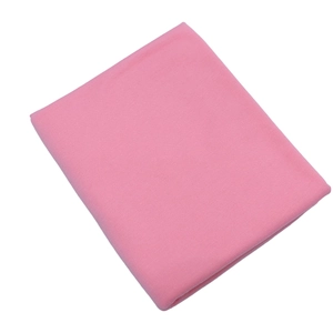 Detailed close-up of pink jersey knit fabric showing soft texture and high-quality finish
