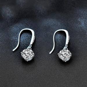 Elegant 925 sterling silver drop earrings with round moissanite in a classic 4-claw setting