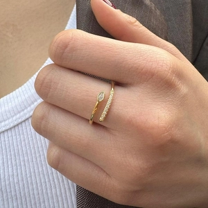 S925 sterling silver snake-shaped open ring with cubic zirconia on a female model