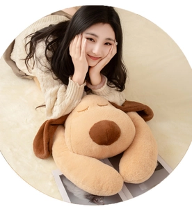 Macro detail of soft plush dog pillow showing high-quality fluffy brown fabric texture