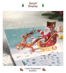 Dettaglio macro del biglietto di Natale 3D pop-up con slitta di renne intagliata al laser
