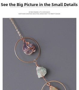 Detailed wire-wrapped raw amethyst suncatcher with copper metal chains and ring
