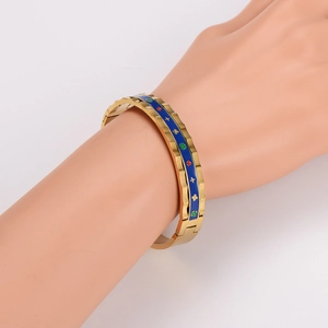 18K gold-plated vintage bangle with dark blue enamel and colorful floral patterns