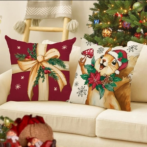 Christmas pillow covers with reindeer and squirrel designs on a cozy white sofa